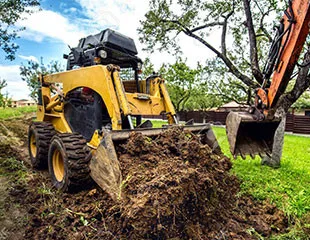 excavator digging up the ground