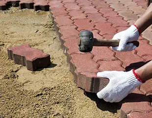 mason laying pavers